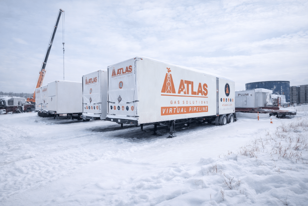 Atlas Gas Solutions trailer on a snowy, winter job site during poor weather conditions.